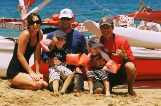 Captain Don Jones on the beach with happy visitors after a beautiful ride on the Tui Tonga Sailing Canoe Photo: Gloria Reed